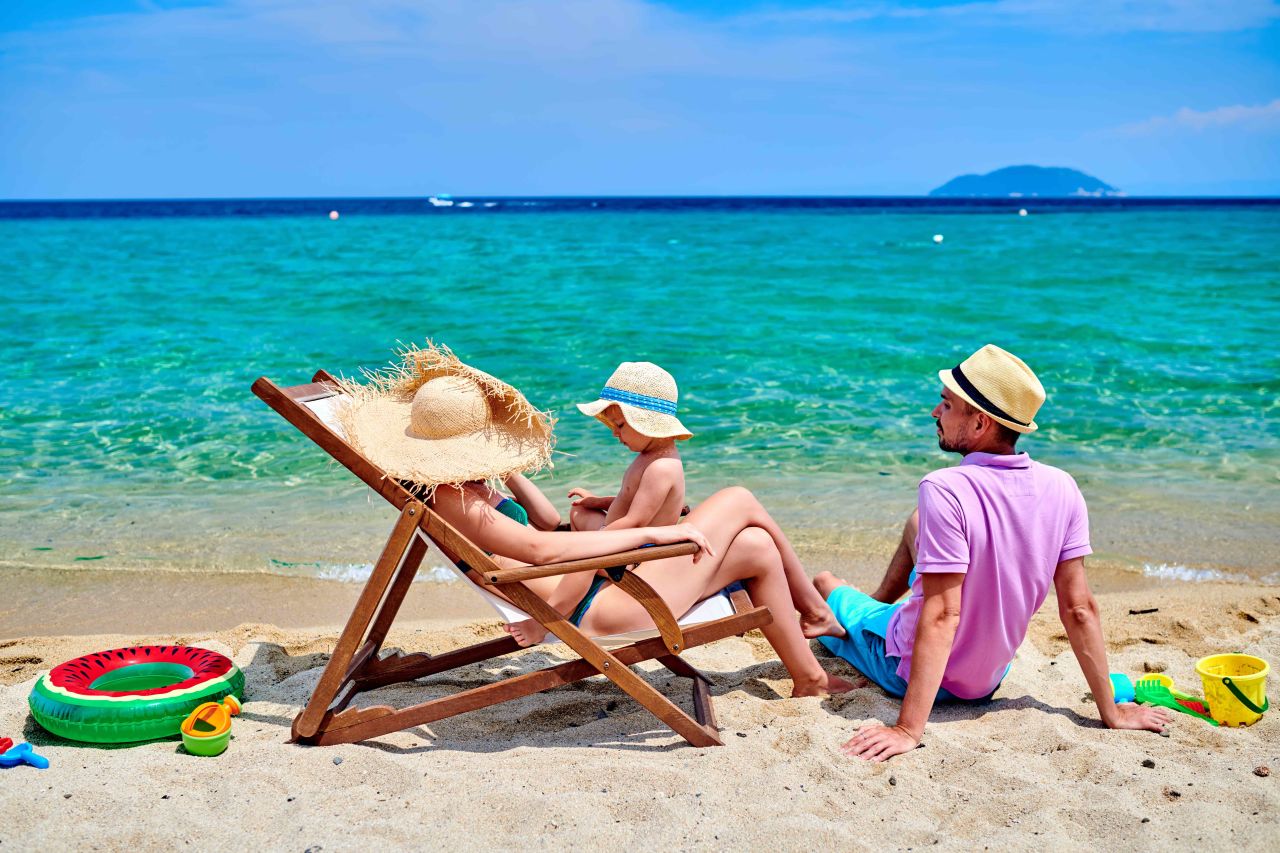 A family on a beach on holiday