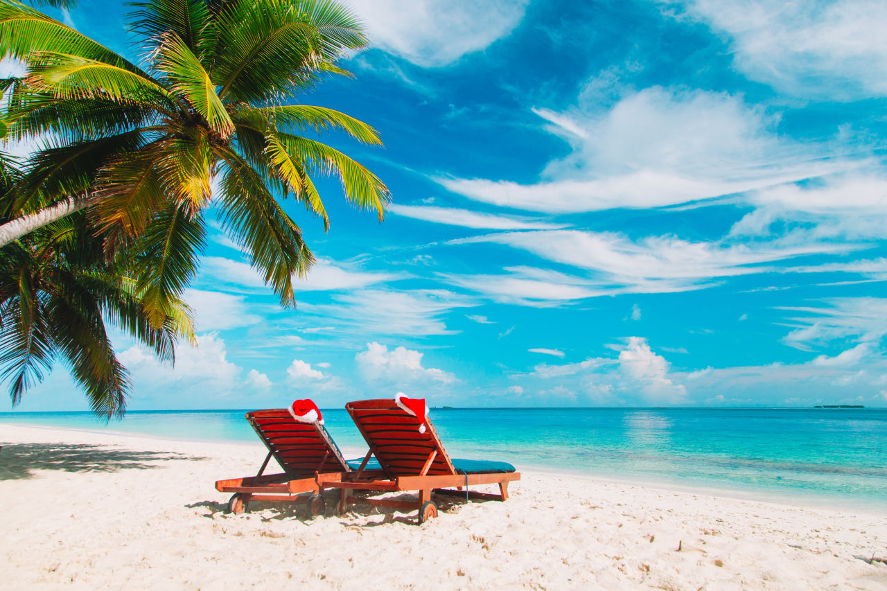 Deck chairs on a white sand beach