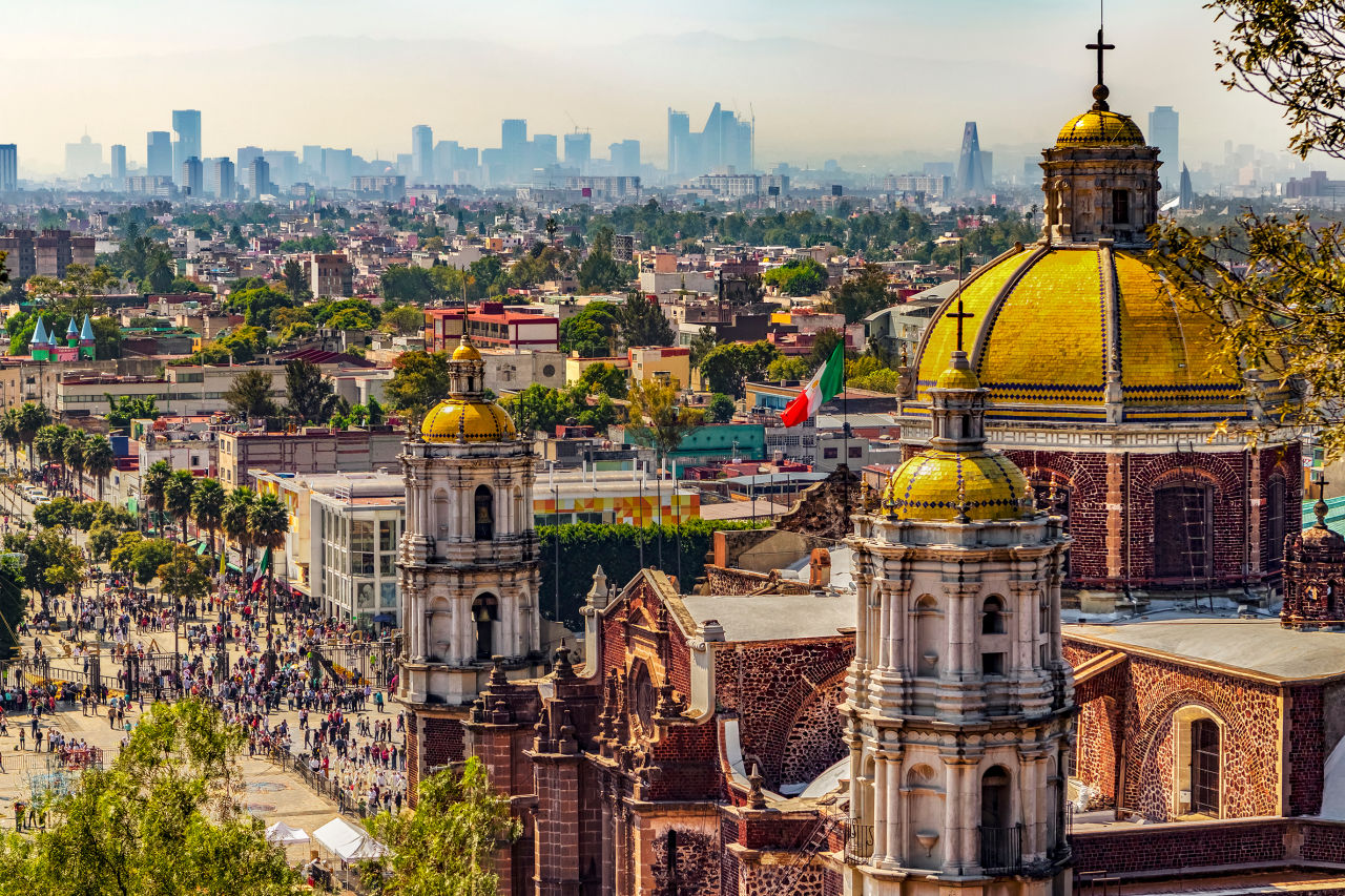 Aerial shot of Mexico city from behind a cathedral