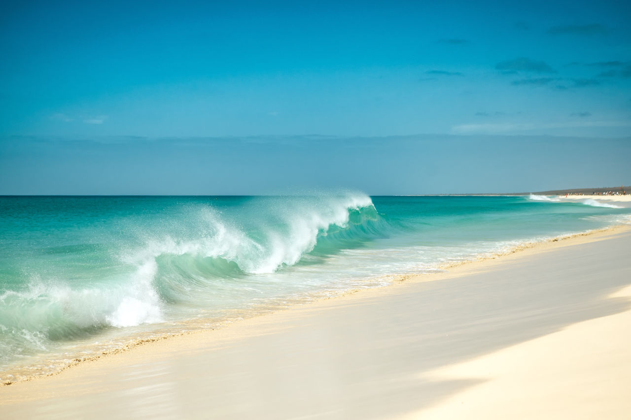 Waves hitting a white sand beach in Cape Verde