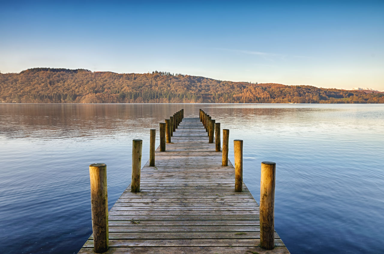 A boardwalk going into a lake in the Lake District