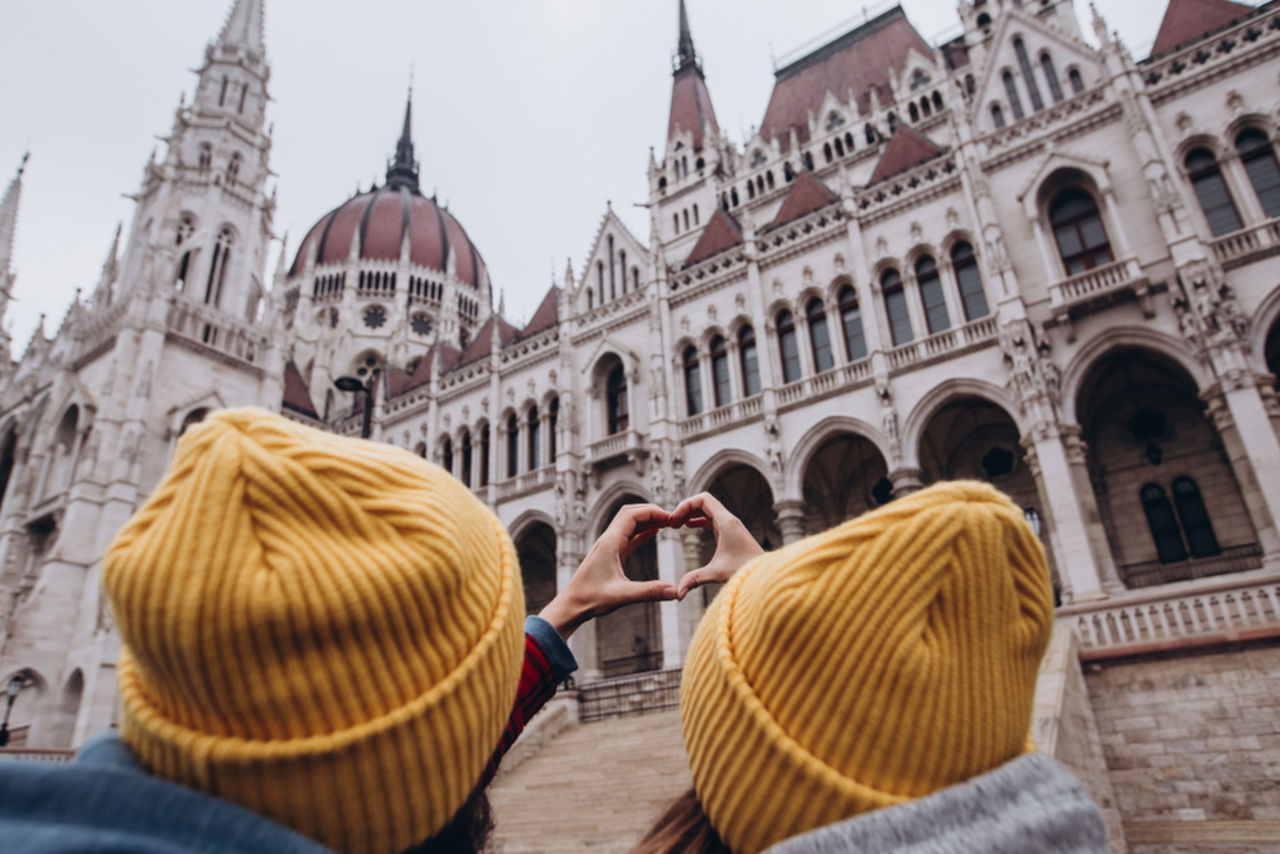 People looking at the Budapest Parliament