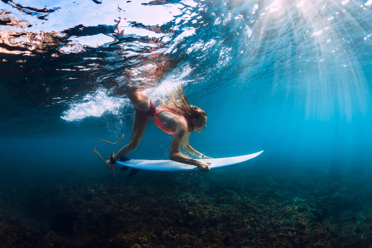Surfer Diving in Maui, Hawaii