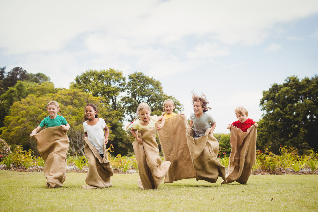 Children participating in a potato sack race