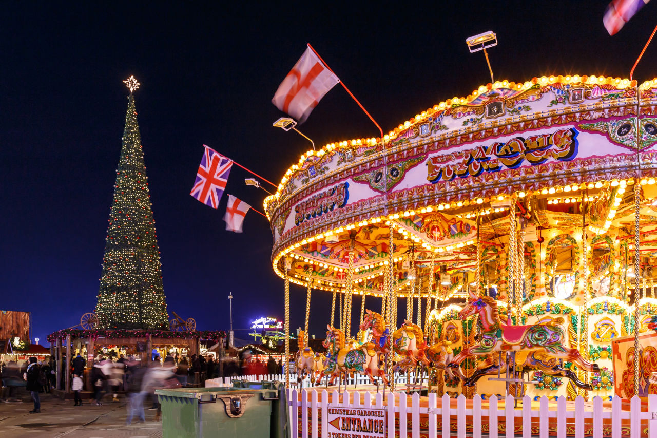 ferris wheel in front of christmas tree in Hyde Park