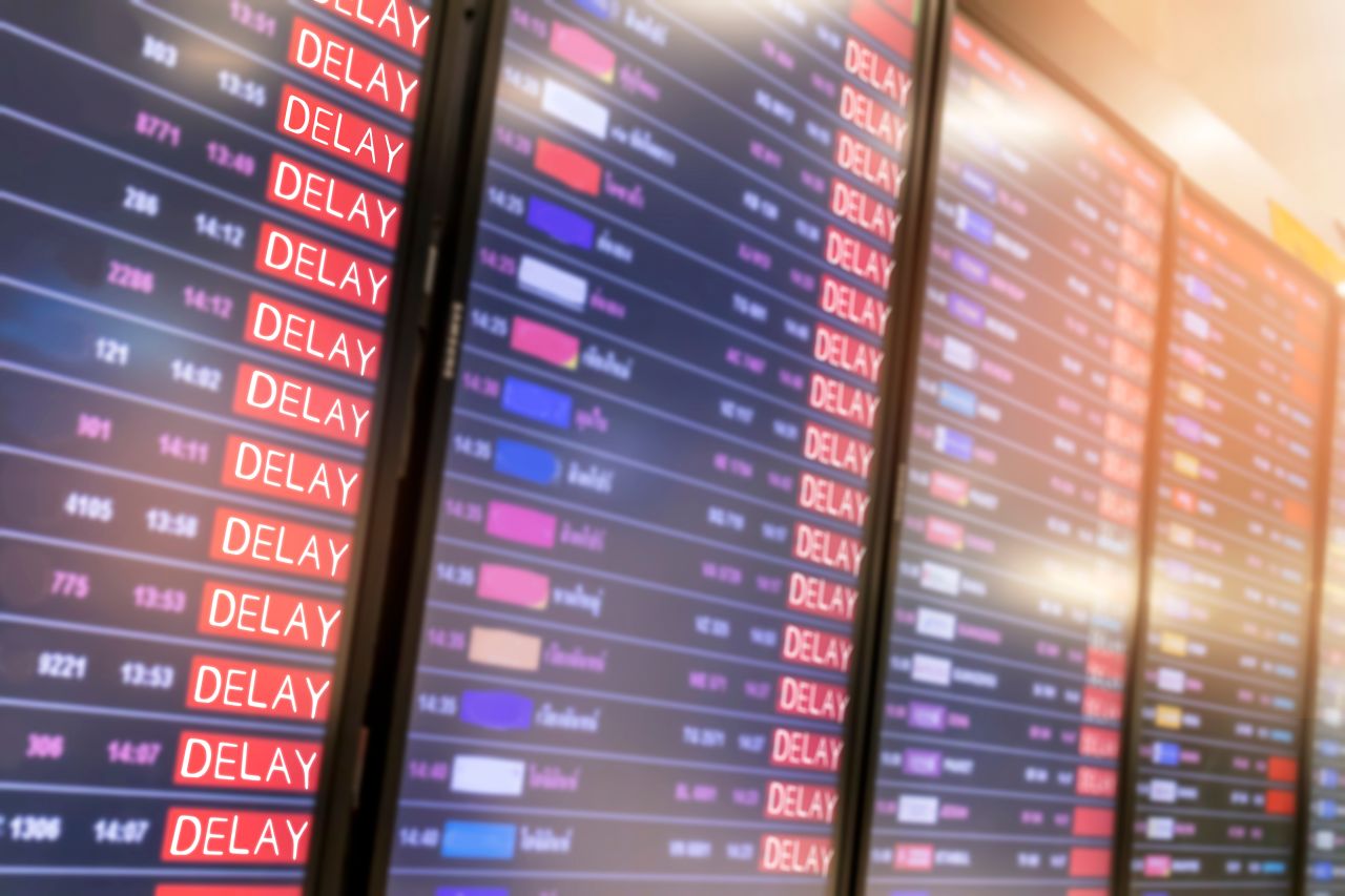 list of cancelled and delayed flights at airport on reader board