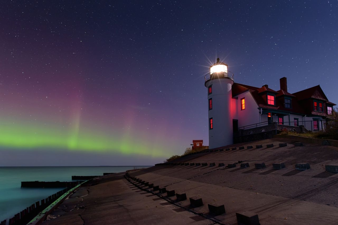 northern lights over michigan with lighthouse