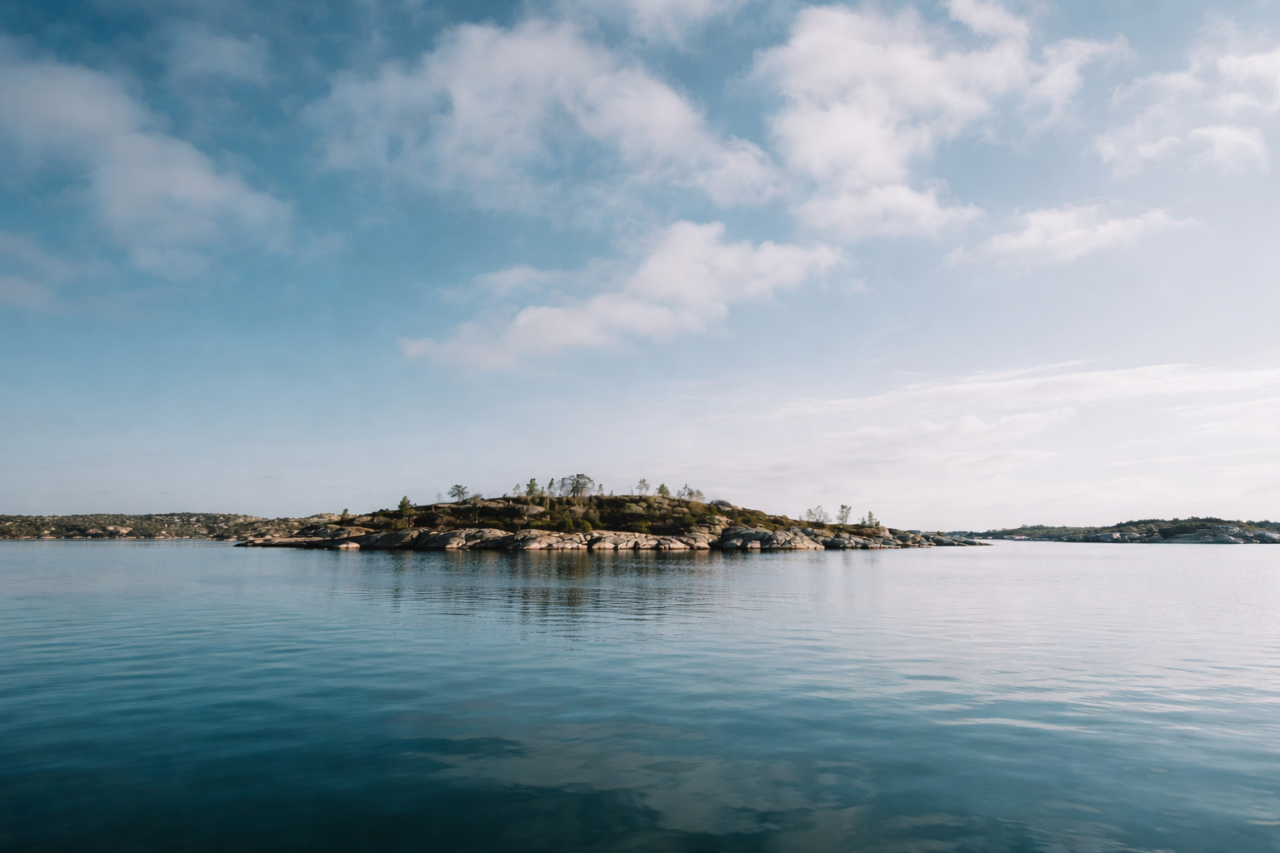 Aerial view of a remote Swedish island surrounded by blue sea in Visit Sweden island giveaway campaign