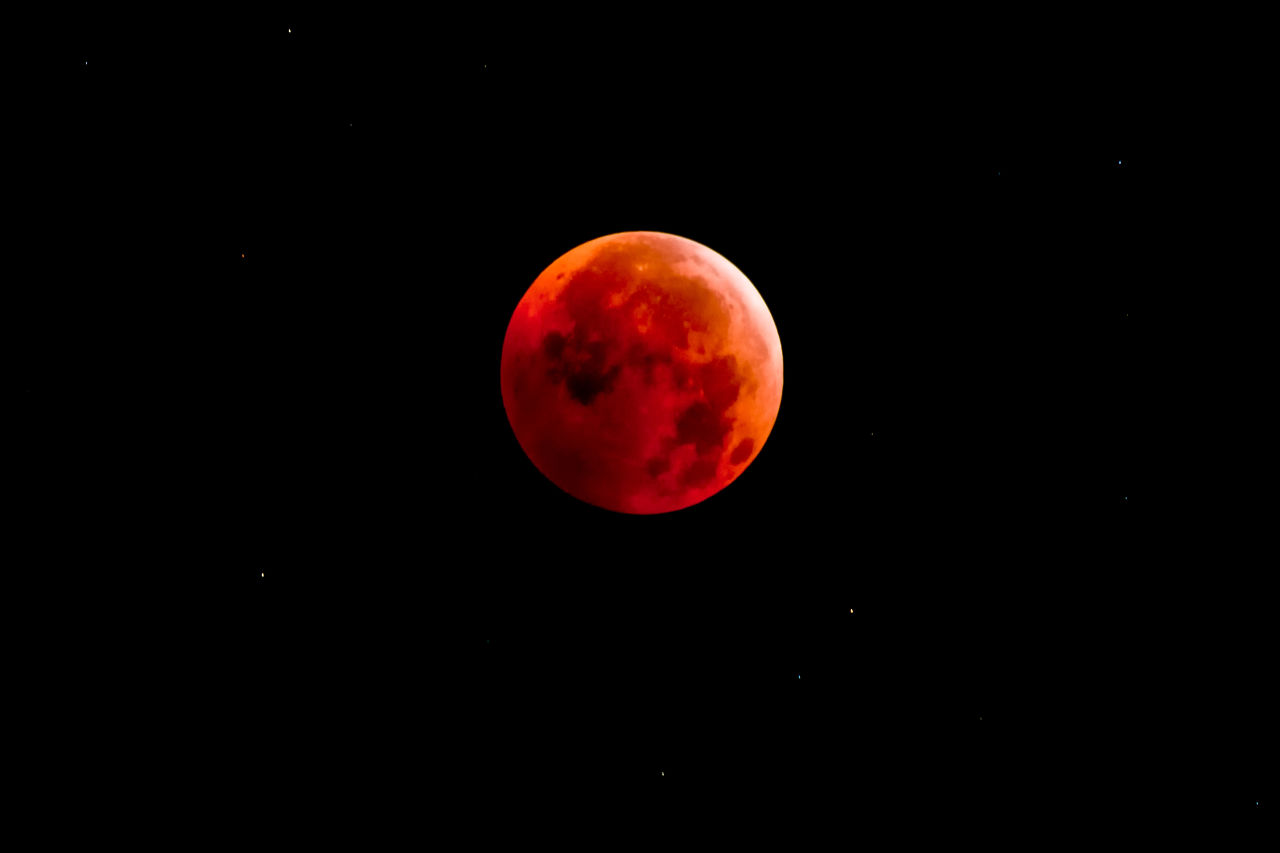 Blood moon total lunar eclipse visible over North America before sunrise