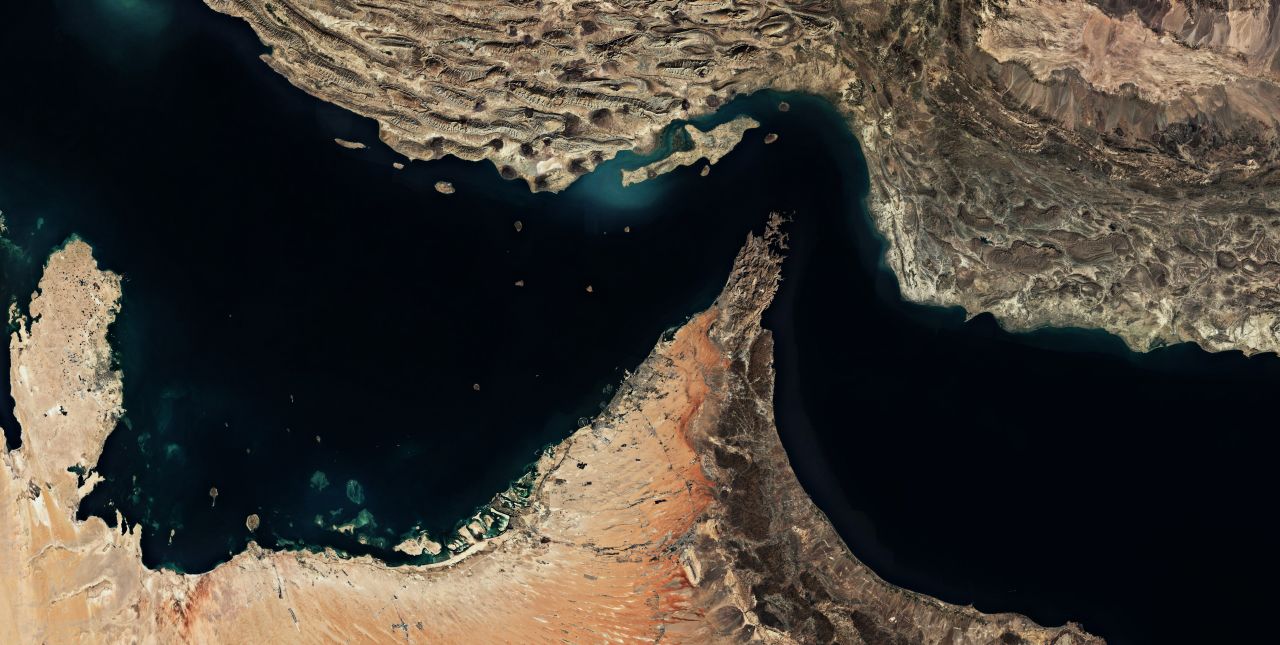 Satellite view of the Strait of Hormuz showing the narrow oil shipping route between Iran and Oman