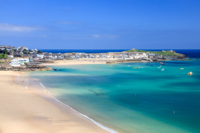 A beach in St Ives, Cornwall, during a bright summer day