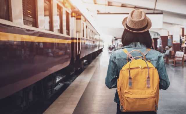 A passenger is about to board a train during an extreme day trip