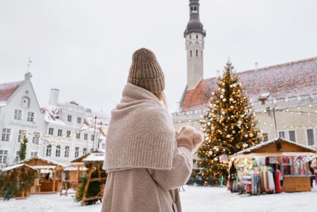 Woman dressed warmly at a Christmas market