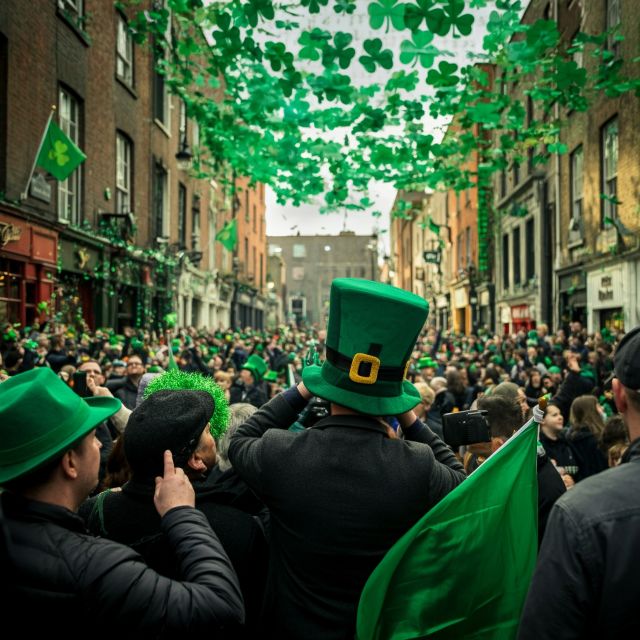 People wearing green clothing and hats celebrating St. Patrick's Day