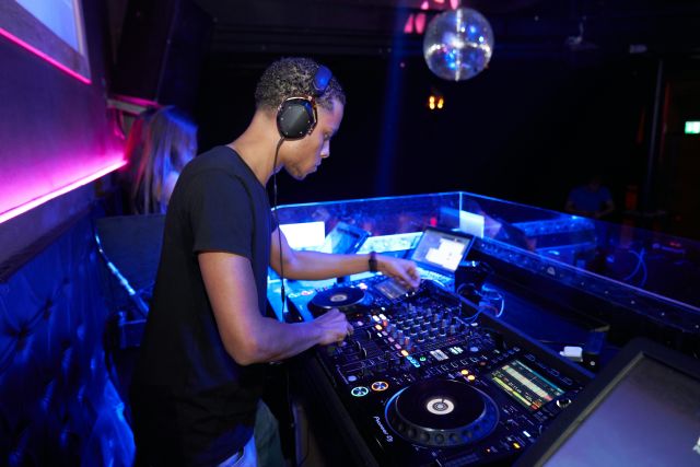 DJ plays a set at a nightclub in Berlin