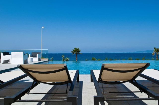 two lounge chairs by the pool