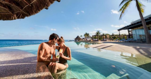 Couple at Grand Park Royal Cozumel Pool