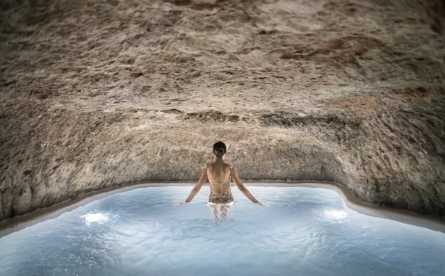 10 Hotels With Cave Pools That Are Almost Too Good to Be Real