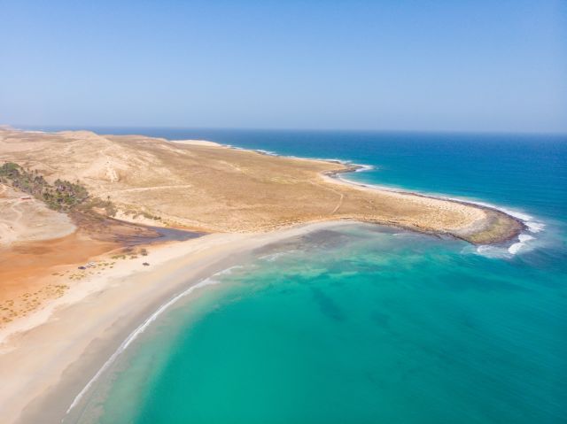 Coast of Boa Vista - paradise island next to the west coast of Africa. Nice waves and surf around the shore of Cape Verde island. Drone image of the Boa vista coast. Perfect sunny