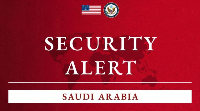 ed US Department of State security alert graphic for Saudi Arabia with the American flag and State Department seal, issued after the October 2026 attacks on Riyadh's King Khalid International Airport